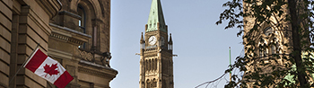 government building and a canadian flag